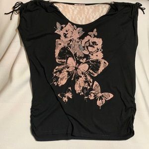 Black and pink floral and butterfly print top with gathered sleeves and hem.